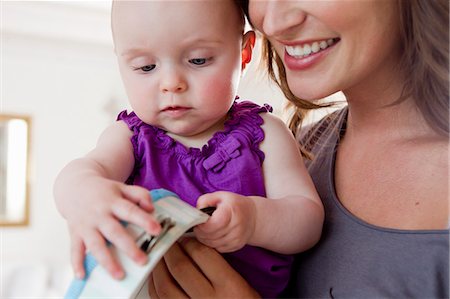 Mother and baby playing with tambourine Stock Photo - Premium Royalty-Free, Code: 649-06304948