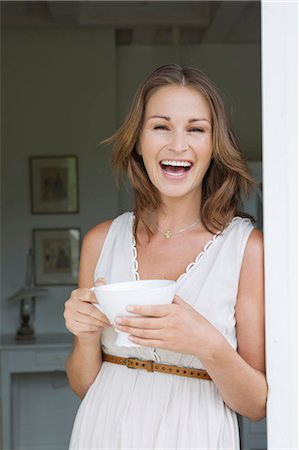 smiling laughing beauty - Smiling woman having cup of coffee Stock Photo - Premium Royalty-Free, Code: 649-06304959