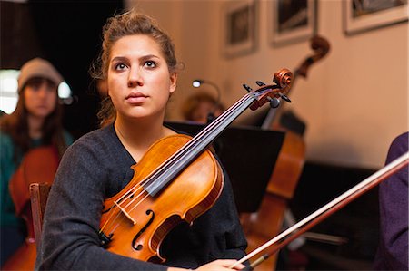 symphony orchestra - Violin player sitting in practice Stock Photo - Premium Royalty-Free, Code: 649-06305065