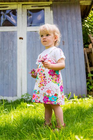 simsearch:649-06305830,k - Girl picking flowers outdoors Stock Photo - Premium Royalty-Free, Code: 649-06305103