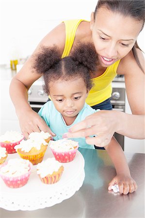 parents and children and cupcakes - Mother and daughter baking together Stock Photo - Premium Royalty-Free, Code: 649-06305115