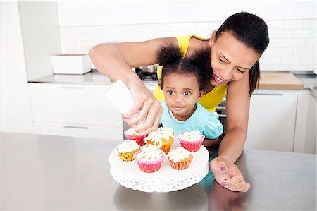 decorating - Mother and daughter baking together Stock Photo - Premium Royalty-Free, Code: 649-06305116