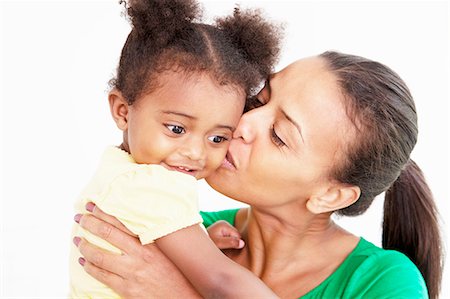 family children silhouette - Mother and daughter kissing in kitchen Stock Photo - Premium Royalty-Free, Code: 649-06305132