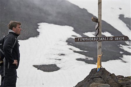 sign post arrows - Hiker reading sign on trail Stock Photo - Premium Royalty-Free, Code: 649-06305468