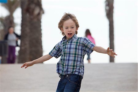 Boy riding skateboard outdoors Stock Photo - Premium Royalty-Free, Code: 649-06305489