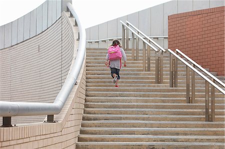 school, walking - Girl climbing steps outdoors Stock Photo - Premium Royalty-Free, Code: 649-06305482