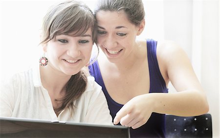 shocked teenagers - Teenage girls using laptop together Stock Photo - Premium Royalty-Free, Code: 649-06305831