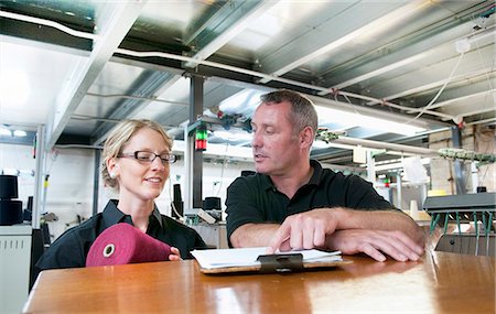 Workers talking in garment factory Stock Photo - Premium Royalty-Free, Code: 649-06305898