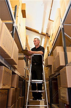 Worker stacking cardboard boxes Stock Photo - Premium Royalty-Free, Code: 649-06305904