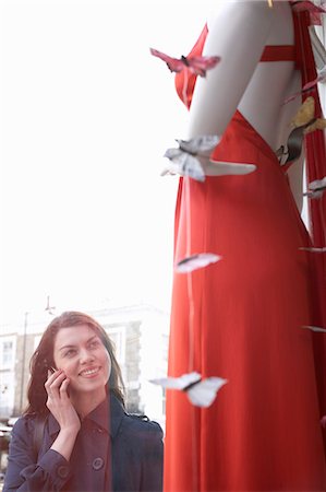 Woman window shopping on city street Stock Photo - Premium Royalty-Free, Code: 649-06305981