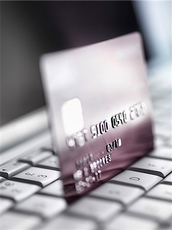 Close up of credit card on keyboard Stock Photo - Premium Royalty-Free, Code: 649-06352450