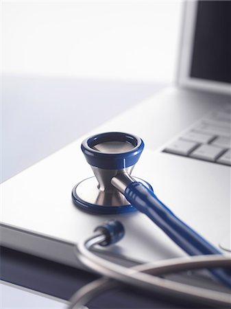 diagnosis - Close up of stethoscope on laptop Stock Photo - Premium Royalty-Free, Code: 649-06352453