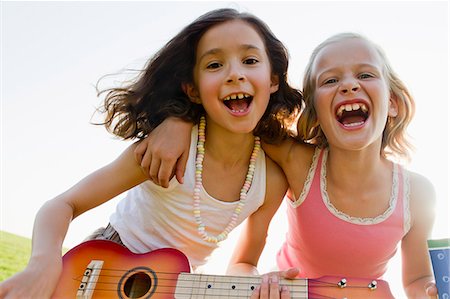 portrait girl smiling - Girls singing together outdoors Stock Photo - Premium Royalty-Free, Code: 649-06352660