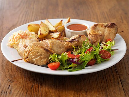 Plate of chicken with salad and potatoes Stock Photo - Premium Royalty-Free, Code: 649-06352864