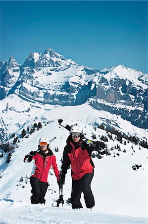 ski goggles mature not senior - Skiers climbing snowy mountainside Stock Photo - Premium Royalty-Free, Code: 649-06353016