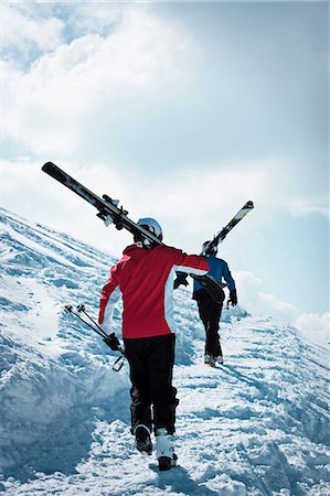 friends travel europe - Skiers climbing up snowy mountainside Stock Photo - Premium Royalty-Free, Code: 649-06353026