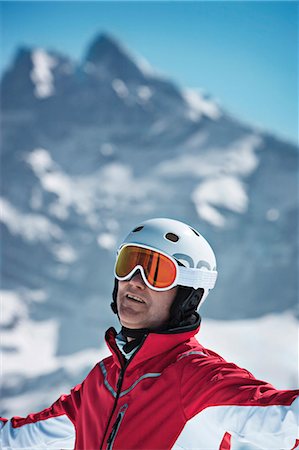 Skier standing on snowy mountain Stock Photo - Premium Royalty-Free, Code: 649-06353021
