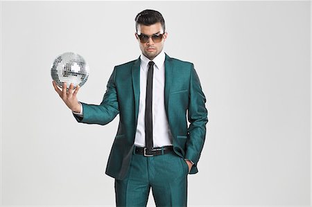 funky - Homme d'affaires tenant la boule disco Photographie de stock - Premium Libres de Droits, Code: 649-06353192