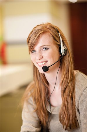 supportive - Businesswoman wearing headset in office Stock Photo - Premium Royalty-Free, Code: 649-06400441