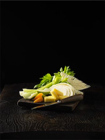 sliced fruits and veggies - Plate of celery, orange, and cabbage Stock Photo - Premium Royalty-Free, Code: 649-06400592