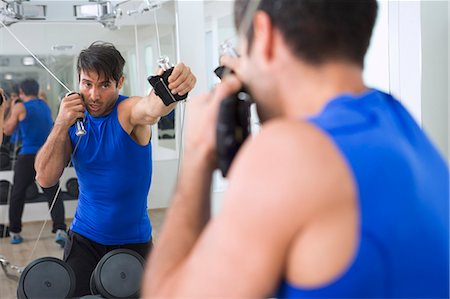 resistente - Boxer practicing with weights in gym Stock Photo - Premium Royalty-Free, Code: 649-06400814