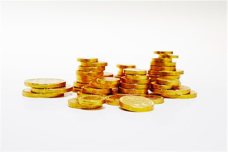 stack of chocolates - Close up of stacks of gold coins Stock Photo - Premium Royalty-Free, Code: 649-06400874