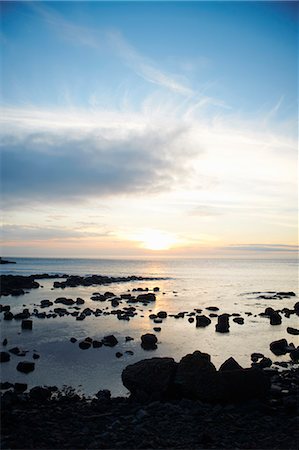 Water washing up on rocky beach Stock Photo - Premium Royalty-Free, Code: 649-06401153