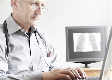 doctor and xray - Doctor using laptop in office Stock Photo - Premium Royalty-Free, Code: 649-06401268
