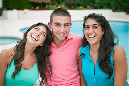 friend swimming pool - Brother and sisters smiling together Stock Photo - Premium Royalty-Free, Code: 649-06401405