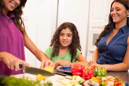 simsearch:649-06401423,k - Sisters cooking together in kitchen Stock Photo - Premium Royalty-Free, Code: 649-06401408