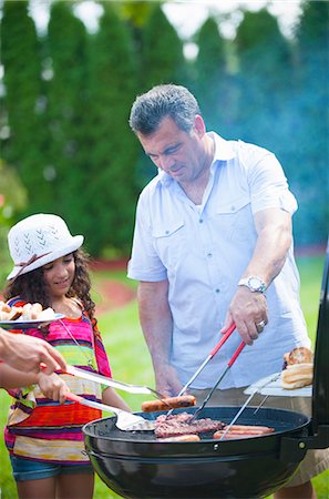 dad and kids cook - Father and daughter grilling outdoors Stock Photo - Premium Royalty-Free, Code: 649-06401459