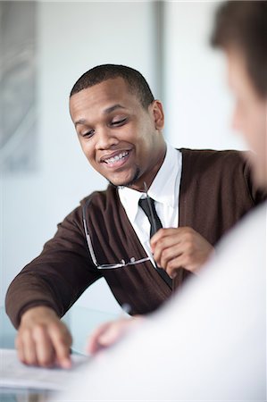 excited african - Businessman talking in meeting Stock Photo - Premium Royalty-Free, Code: 649-06432310