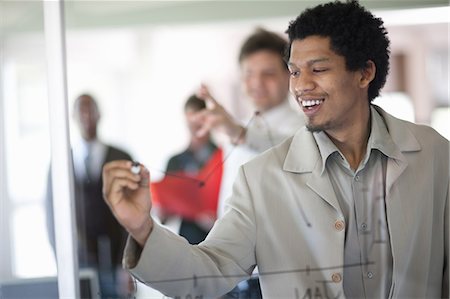 people economics - Businessman drawing graph on window Stock Photo - Premium Royalty-Free, Code: 649-06432325