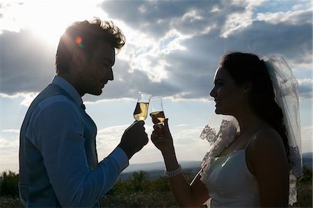silhouette two people - Newlywed couple having champagne Stock Photo - Premium Royalty-Free, Code: 649-06432575