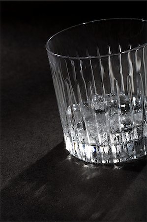 Empty glass of ice on table Stock Photo - Premium Royalty-Free, Code: 649-06432633