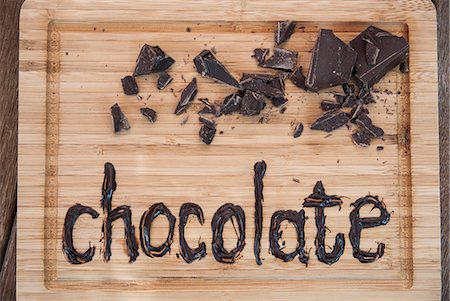 Chocolate written on cutting board Stock Photo - Premium Royalty-Free, Code: 649-06432649