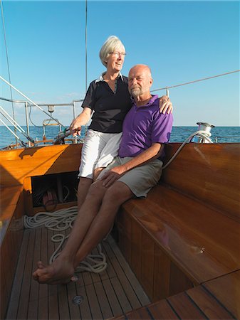 Older couple relaxing on sailboat Stock Photo - Premium Royalty-Free, Code: 649-06432709