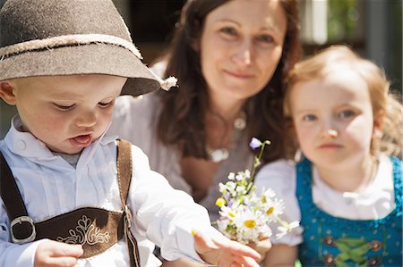 smile family spring - Children in traditional Bavarian clothes Stock Photo - Premium Royalty-Free, Code: 649-06432732