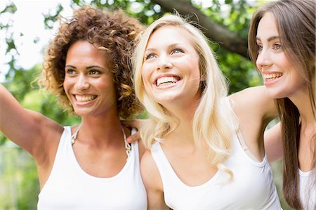 friends smiling together - Smiling women standing together Stock Photo - Premium Royalty-Free, Code: 649-06432905