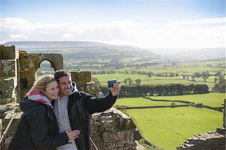 Couple taking picture on medieval ruins Stock Photo - Premium Royalty-Free, Code: 649-06433128