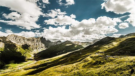 switzerland mountain pic - Clouds over grassy rural landscape Stock Photo - Premium Royalty-Free, Code: 649-06433176