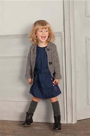singing - Smiling girl shouting indoors Stock Photo - Premium Royalty-Free, Code: 649-06433327