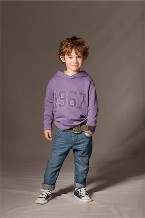 stood - Boy smiling in studio Stock Photo - Premium Royalty-Free, Code: 649-06433349