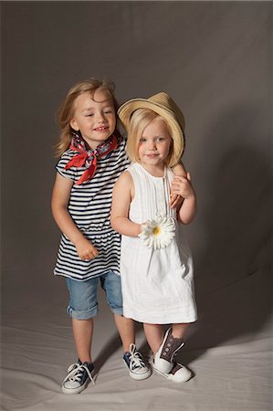studio kid fashion - Girls smiling in studio Stock Photo - Premium Royalty-Free, Code: 649-06433355