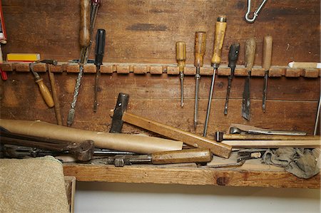 Chisels and wood on workbench Stock Photo - Premium Royalty-Free, Code: 649-06433385