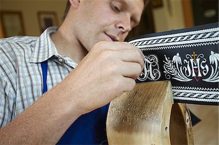 embellished - Worker examining weaving in shop Stock Photo - Premium Royalty-Free, Code: 649-06433453