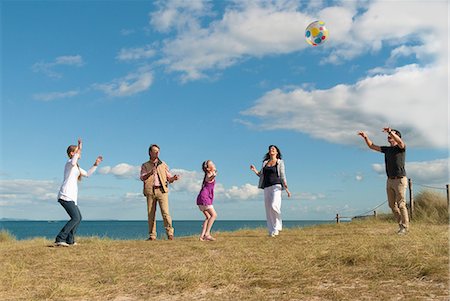 family playing with beach ball - Family playing together outdoors Stock Photo - Premium Royalty-Free, Code: 649-06433475