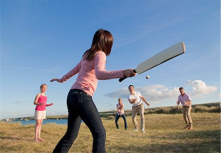 playing a game - Family playing cricket together outdoors Stock Photo - Premium Royalty-Free, Code: 649-06433497