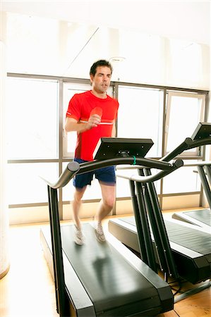 exercising indoors one - Man running on treadmill at gym Stock Photo - Premium Royalty-Free, Code: 649-06433564