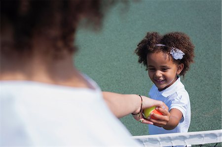 pictures of family playing sports - Mother and daughter playing on court Stock Photo - Premium Royalty-Free, Code: 649-06433606